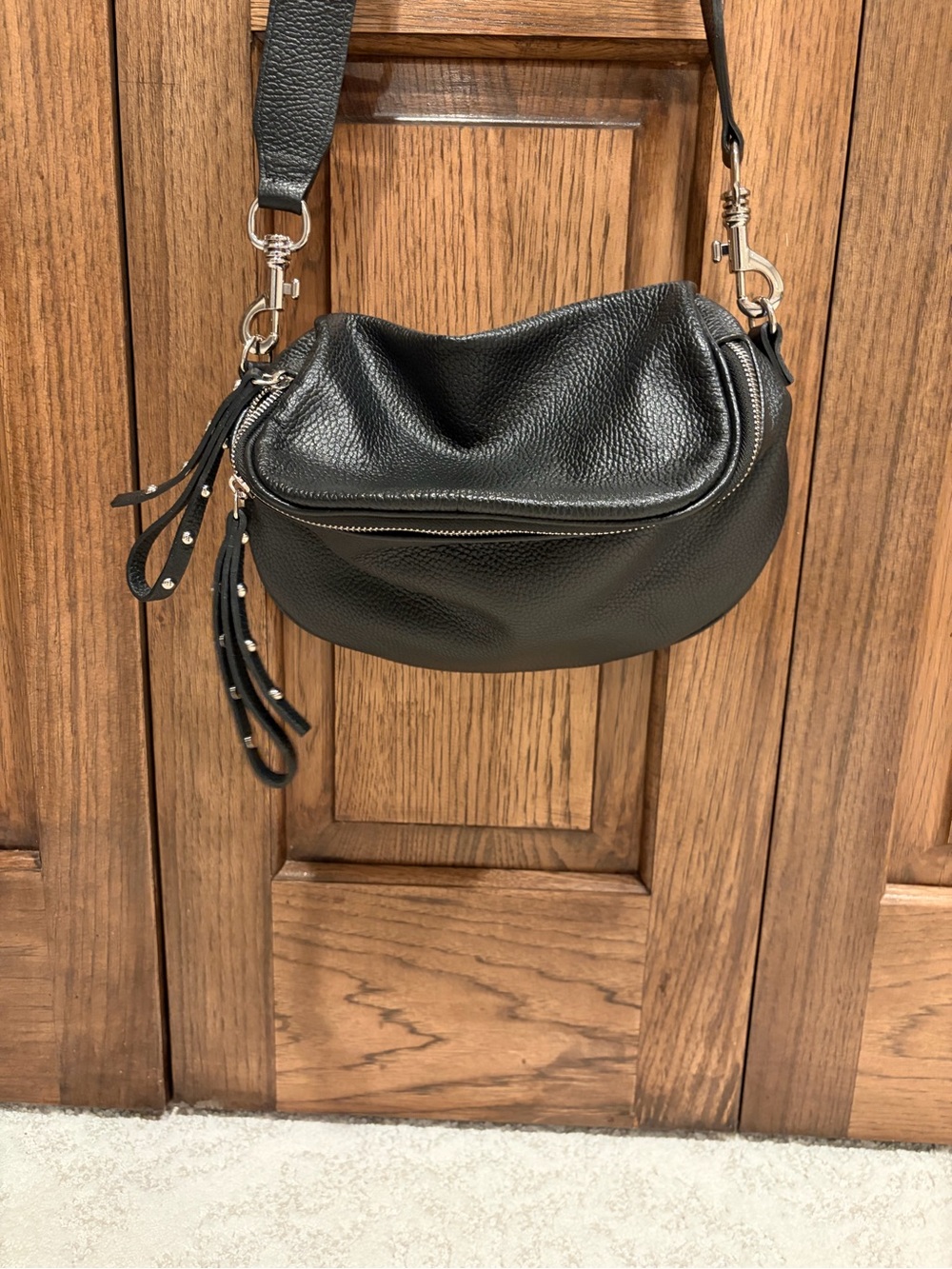 Classic Black Pebbled Leather Crossbody with Studded Tassel